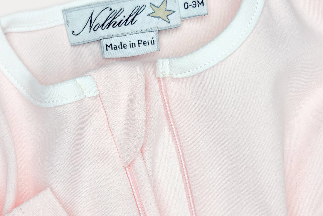 Detail shot of Nolhill Lina romper hidden zipper, European-influenced newborn design