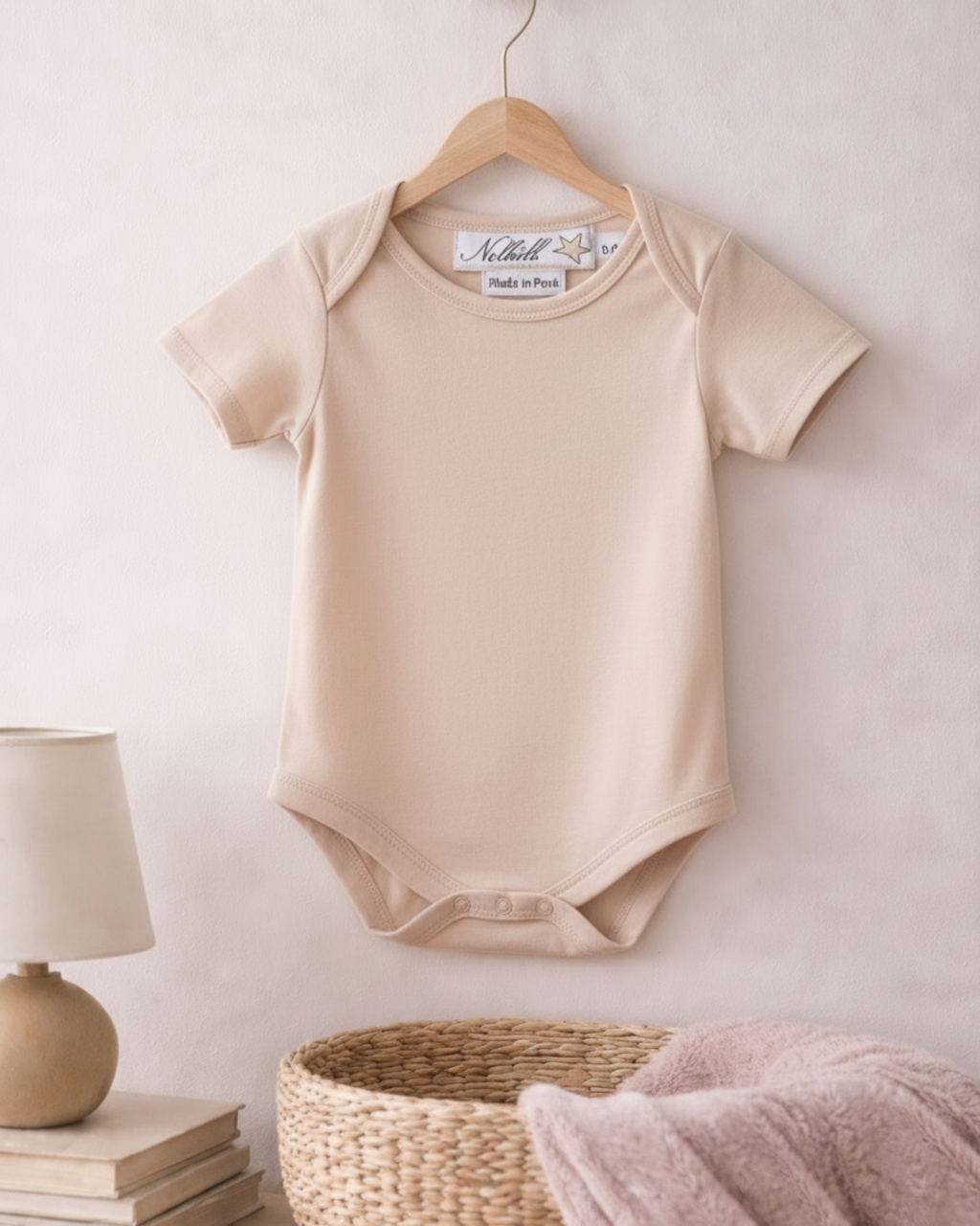Oatmeal,  Lifestyle image of Nolhill Essential Pima cotton bodysuit for newborns