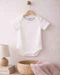 White, Lifestyle image of Nolhill Essential Pima cotton bodysuit for newborns