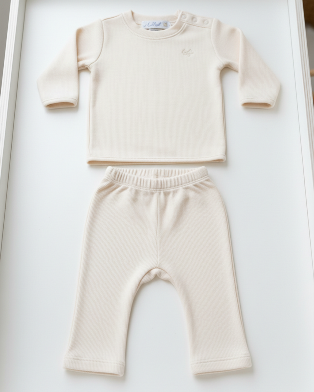 Bianca-, Lifestyle Nolhill Freya 2-piece Piqué layette set in cream Pima cotton with tonal embroidery, front view