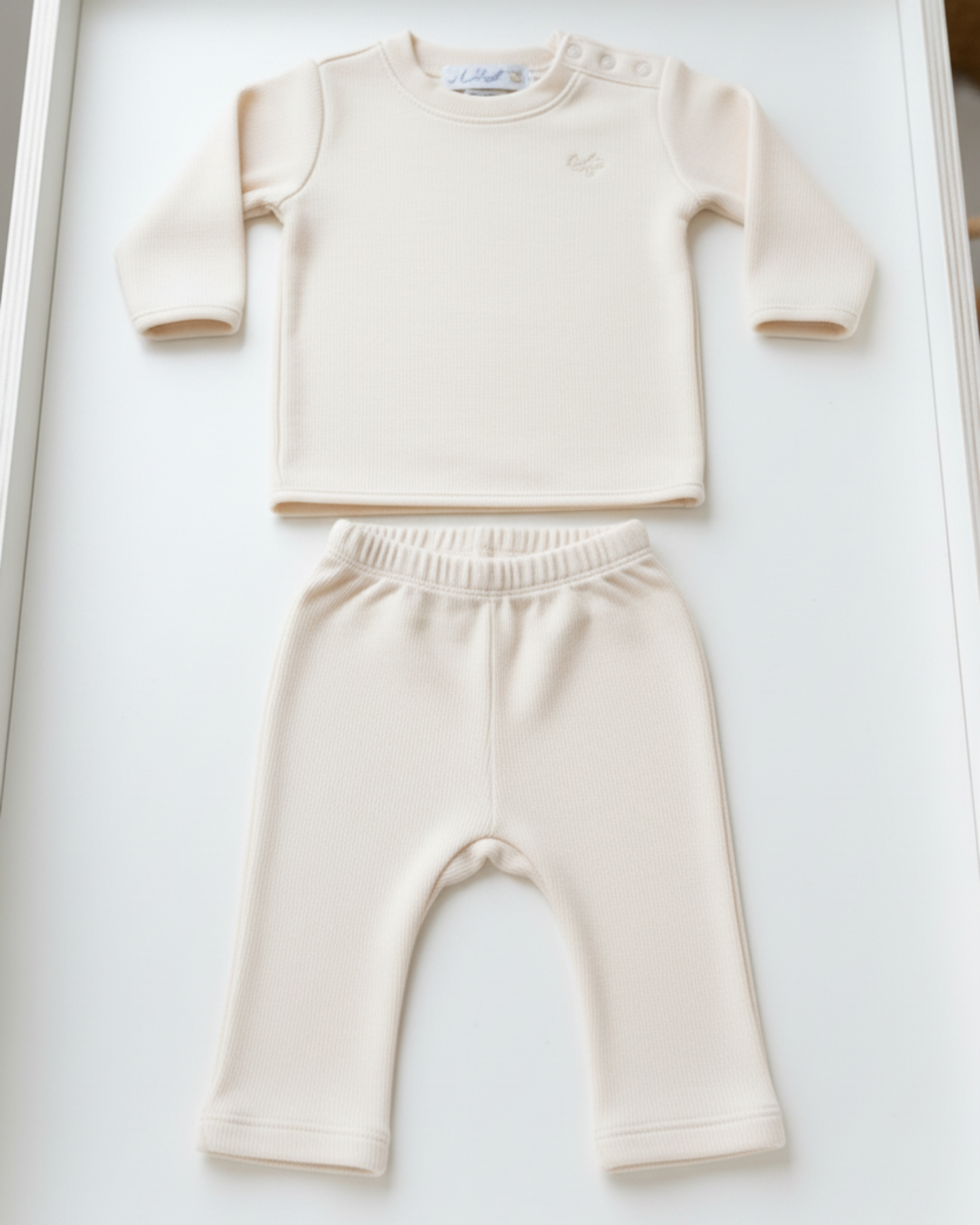 Bianca-, Lifestyle Nolhill Freya 2-piece Piqué layette set in cream Pima cotton with tonal embroidery, front view