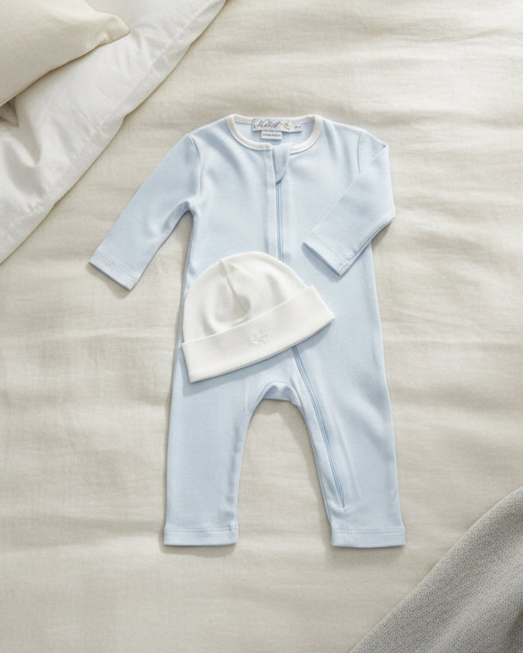 Arctic blue, Lifestyle Nolhill Gramercy Boy newborn gift set with Nicolas romper and Valentine Beane in Pima cotton.