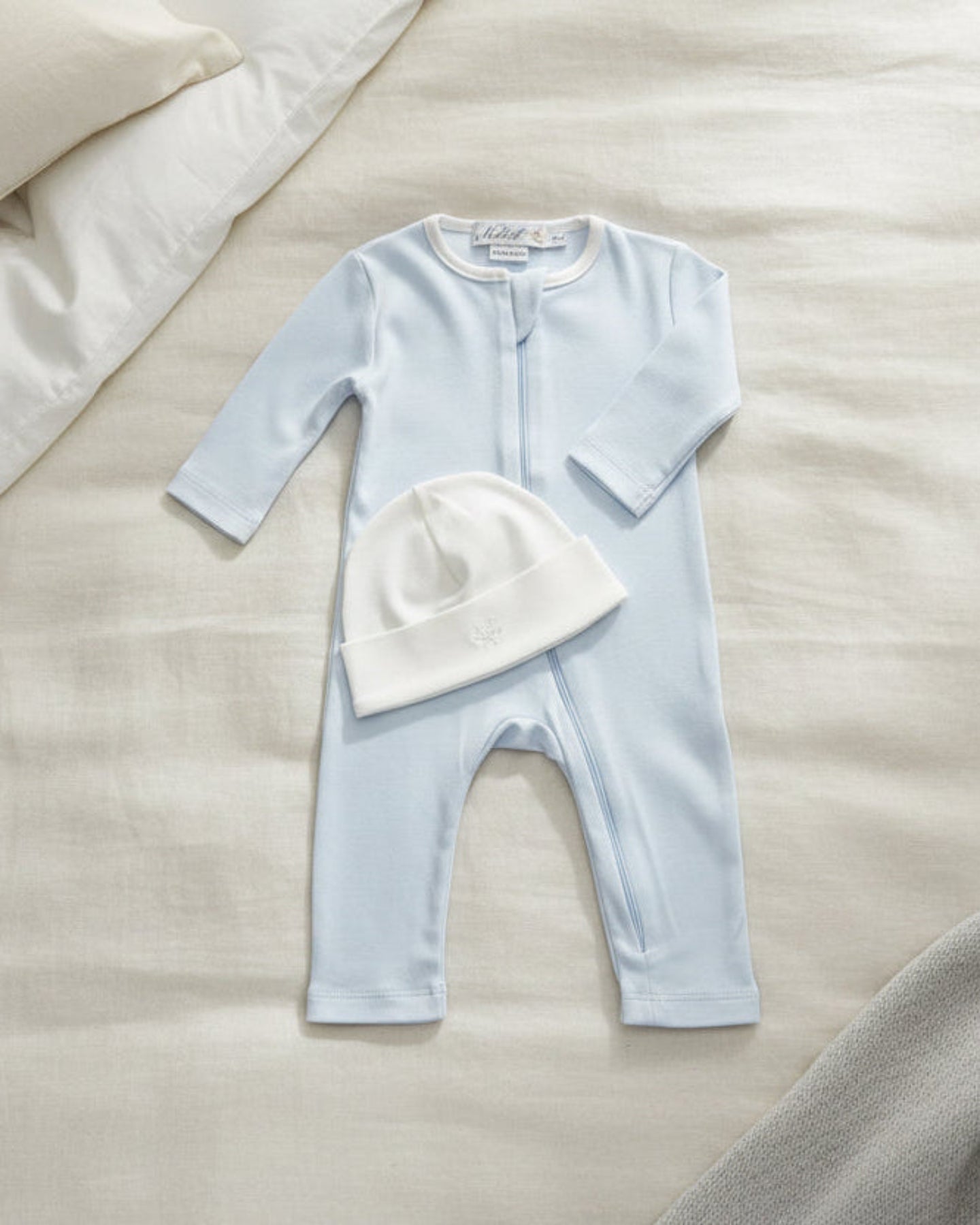 Arctic blue, Lifestyle Nolhill Gramercy Boy newborn gift set with Nicolas romper and Valentine Beane in Pima cotton.
