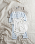 White, Arctic blue, Lifestyle Nolhill Madison Boy complete newborn gift set with layette, romper, bodysuit, beanie and bib in Pima cotton