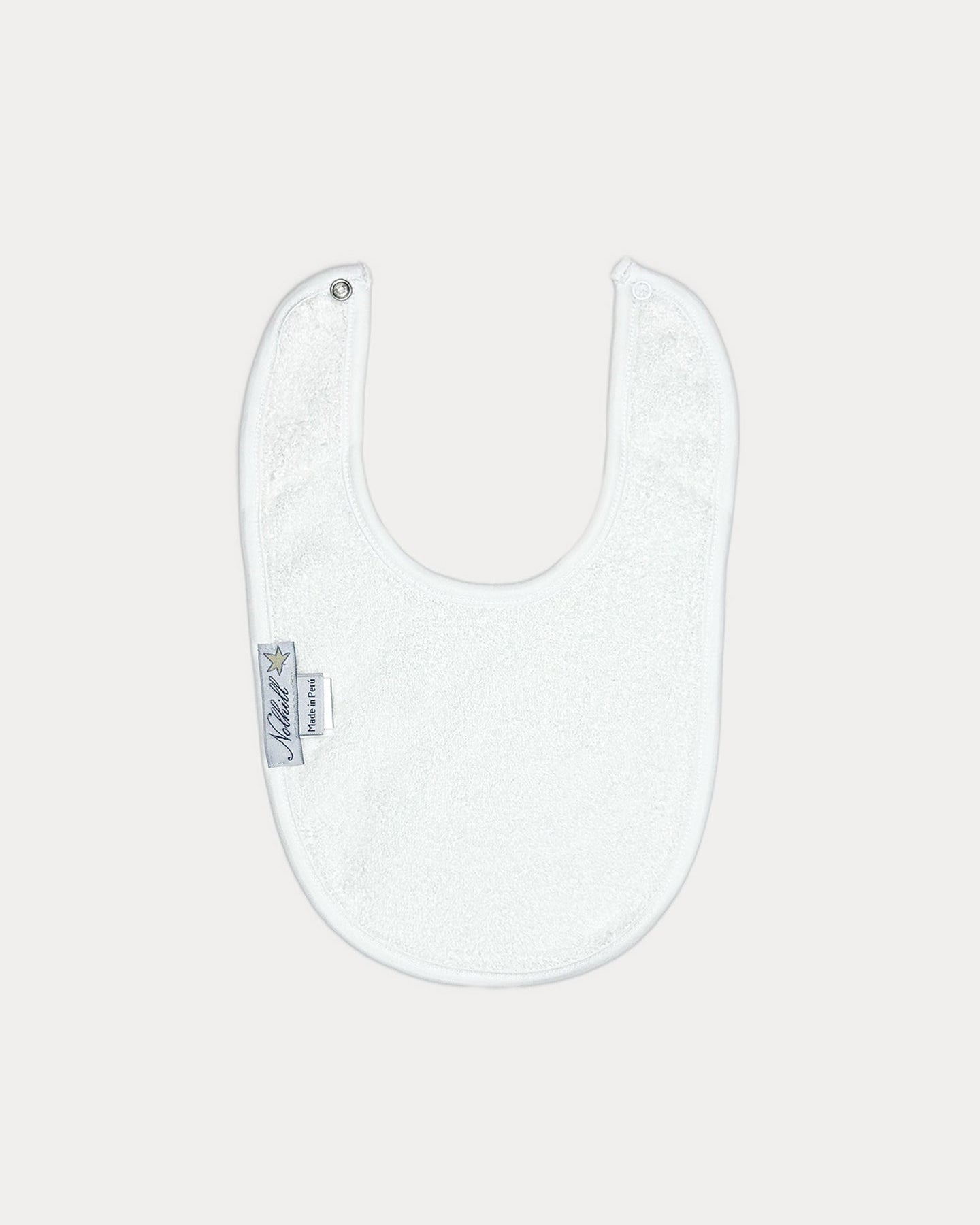 white, The Remy bib by Nolhill, back view showing soft Pima cotton backing
